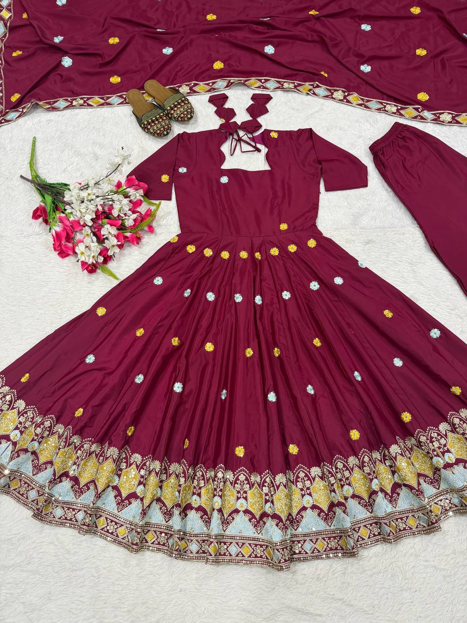 Majestic Wine Flared Anarkali Suit Set Adorned with Delicate Floral Scattered Motifs and an Ornate Heritage Embroidered Border